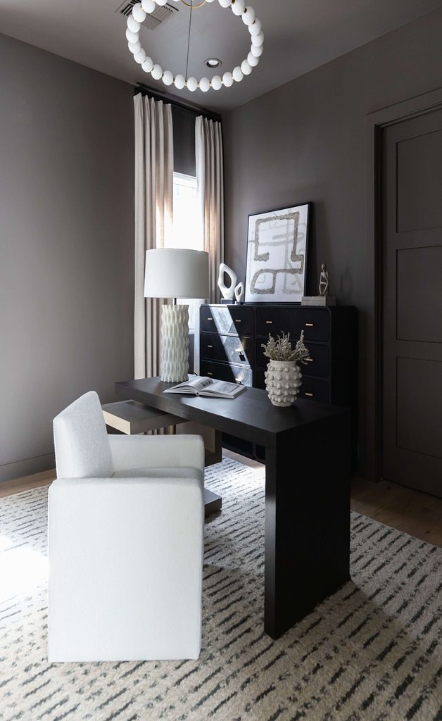  Modern office with black desk and white chair