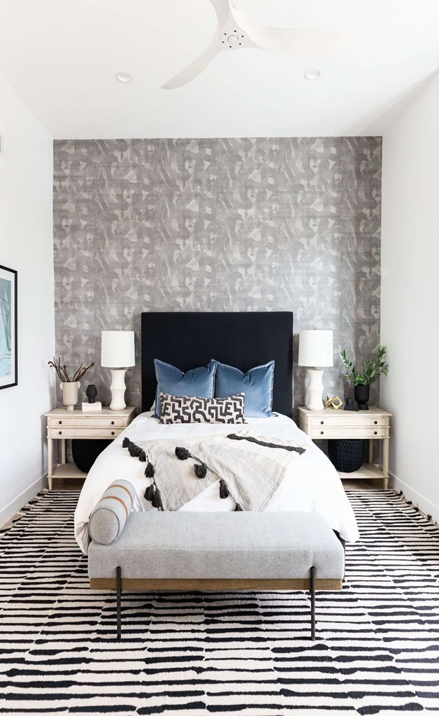  Modern bedroom with black headboard and patterned rug