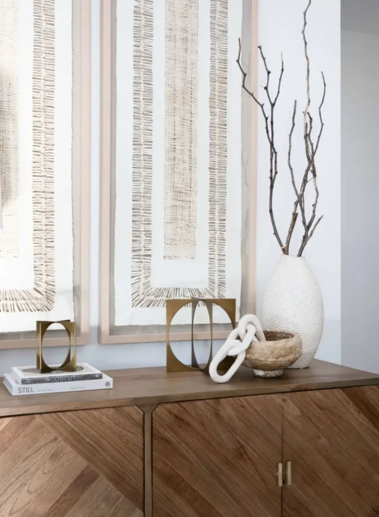 Modern decor on wood cabinet with art and ceramics