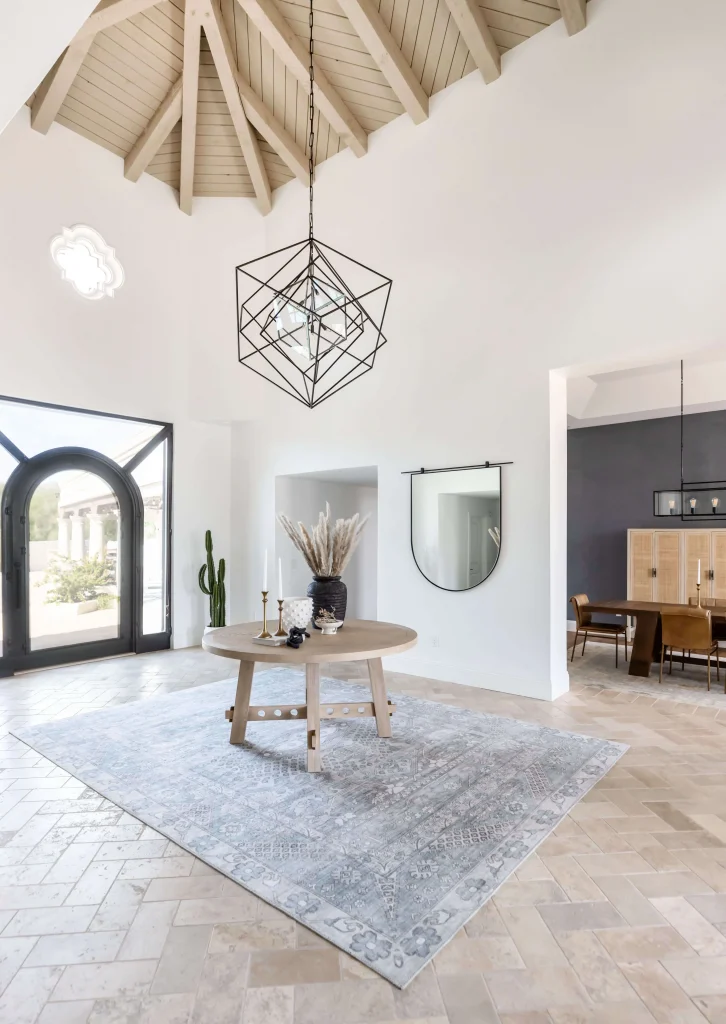 Bright modern room with round table and geometric light