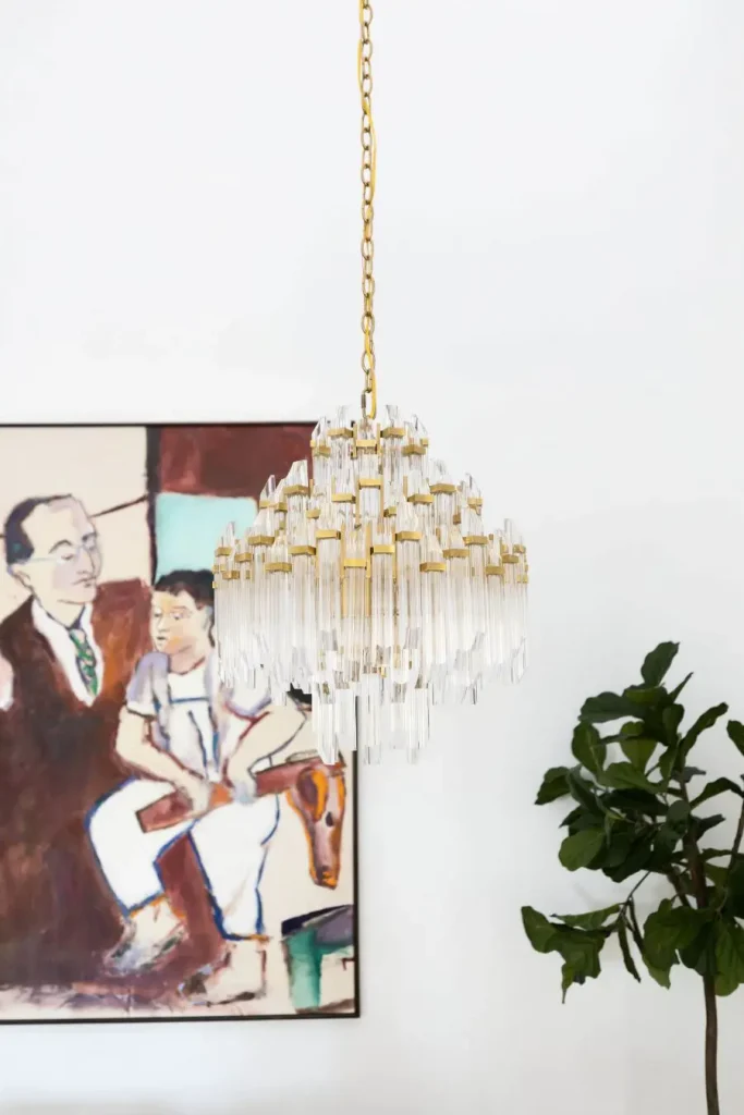 Elegant crystal chandelier with gold accents in modern room