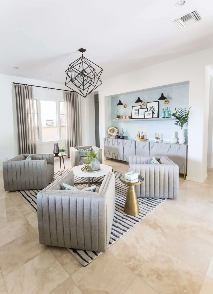 Contemporary living room with four armchairs, modern chandelier, and bar nook