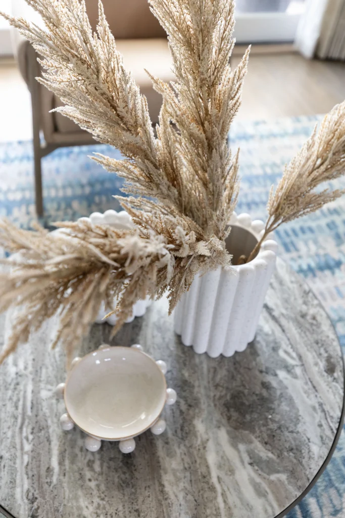 Close-up of pampas grass in white vase