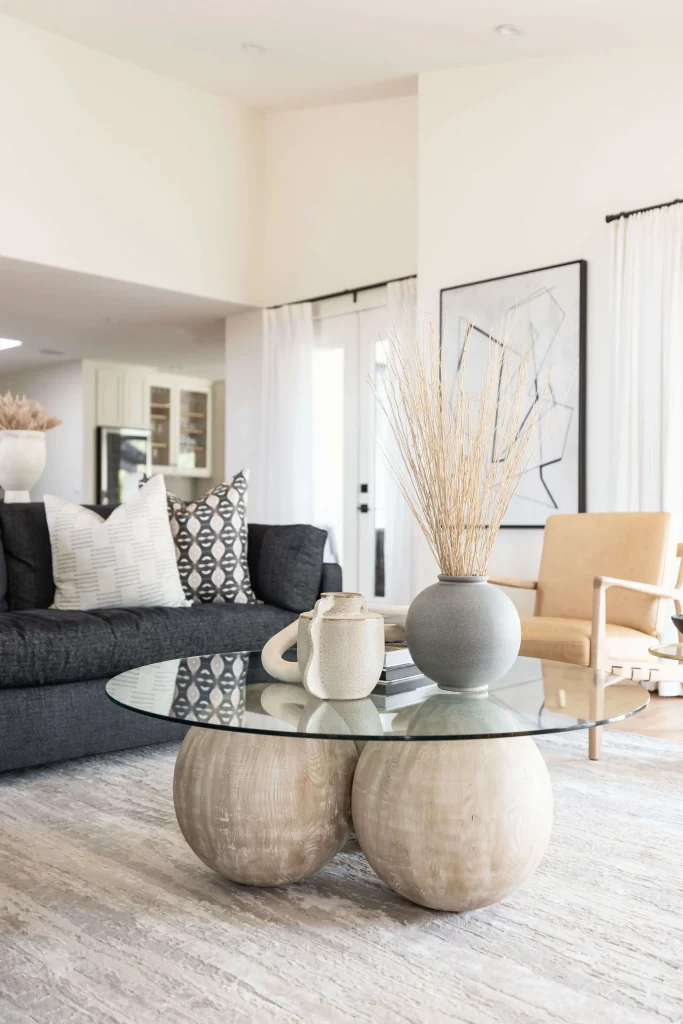 Sofa and coffee table with ceramic decor and art wall