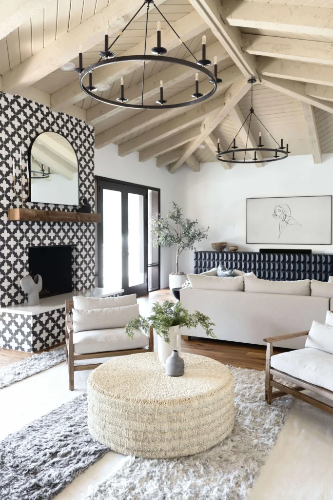 Living room with patterned fireplace and woven coffee table
