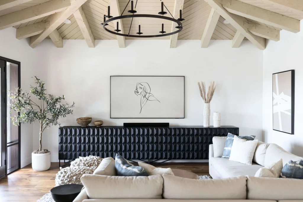 Living room with black console and minimalist art"