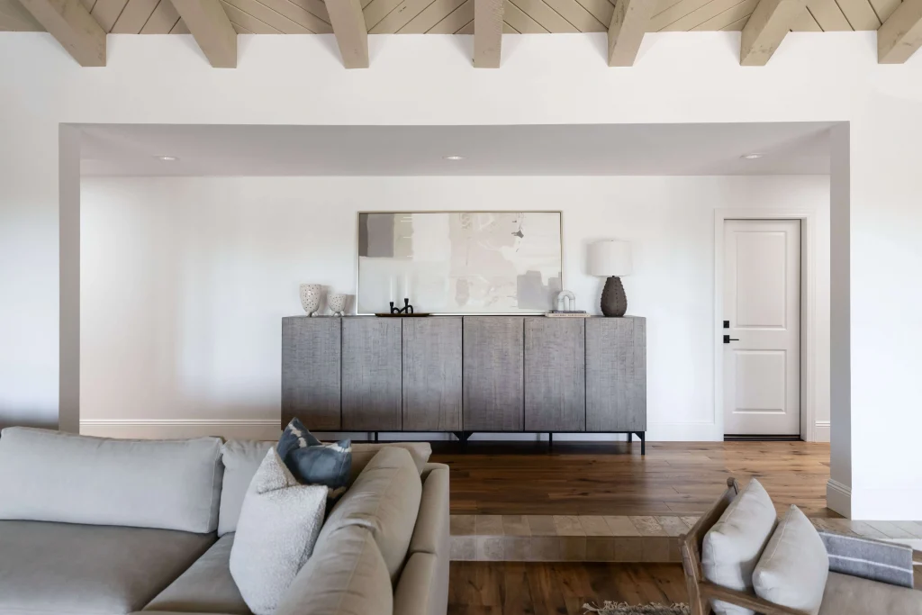 Console table with abstract art and lamp"