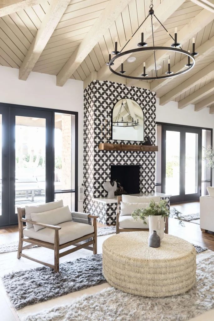 Living room with patterned fireplace and wooden chairs