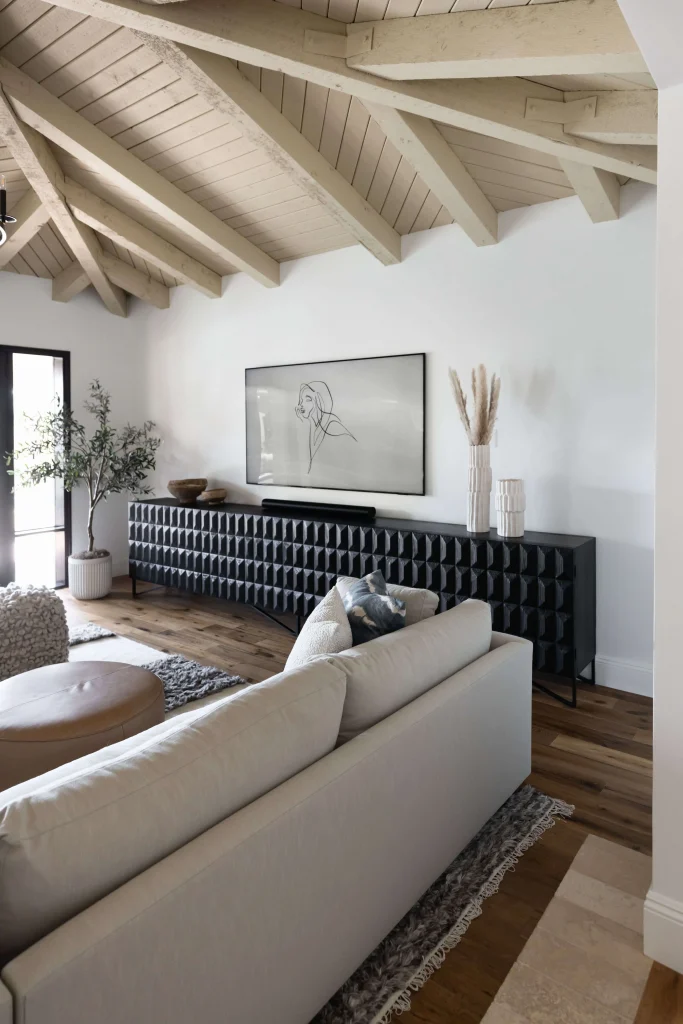 Living room with black textured console and artwork