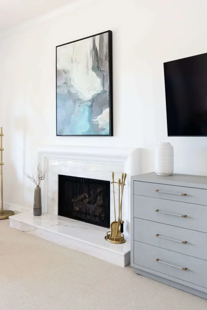 Bright living area with fireplace, TV, and modern decor