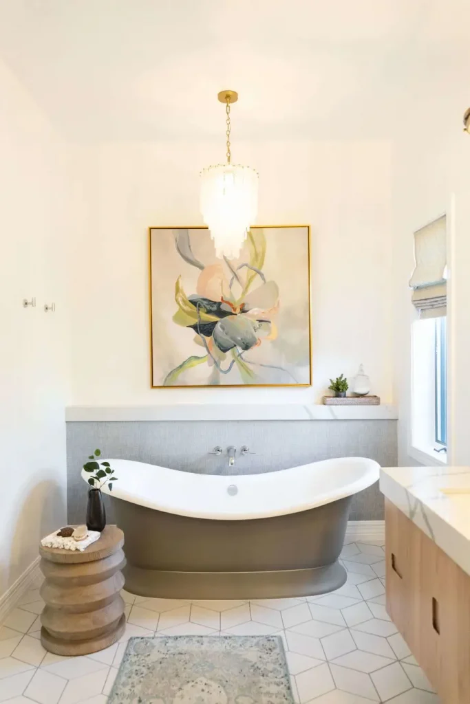 Bathroom with freestanding tub and abstract wall art