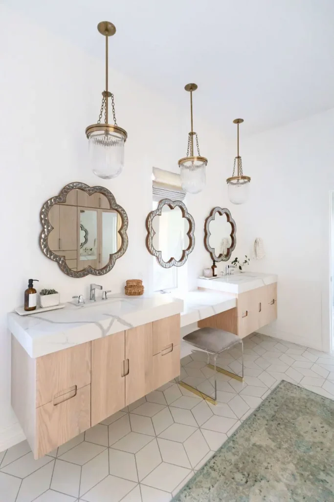 Bright bathroom with three flower-shaped mirrors and pendant lights