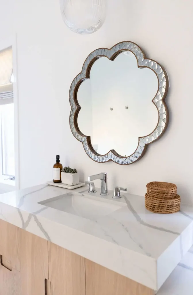 Modern bathroom sink with floral-shaped mirror