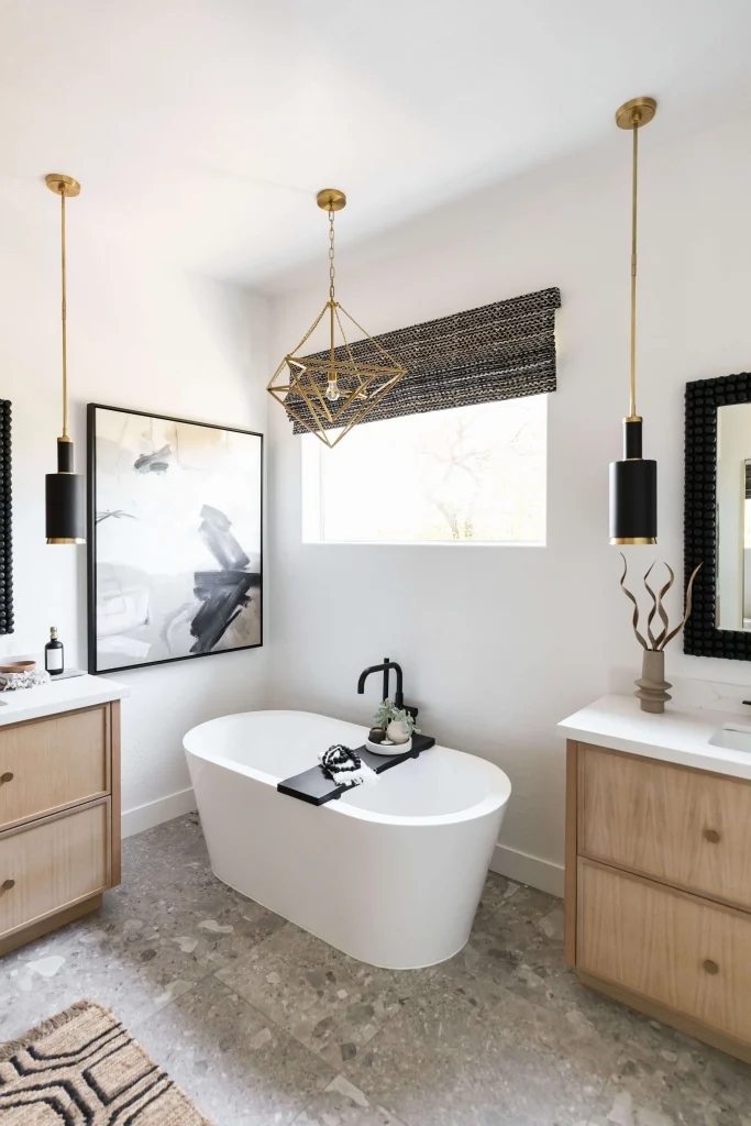 Freestanding tub with wood vanities and black fixtures