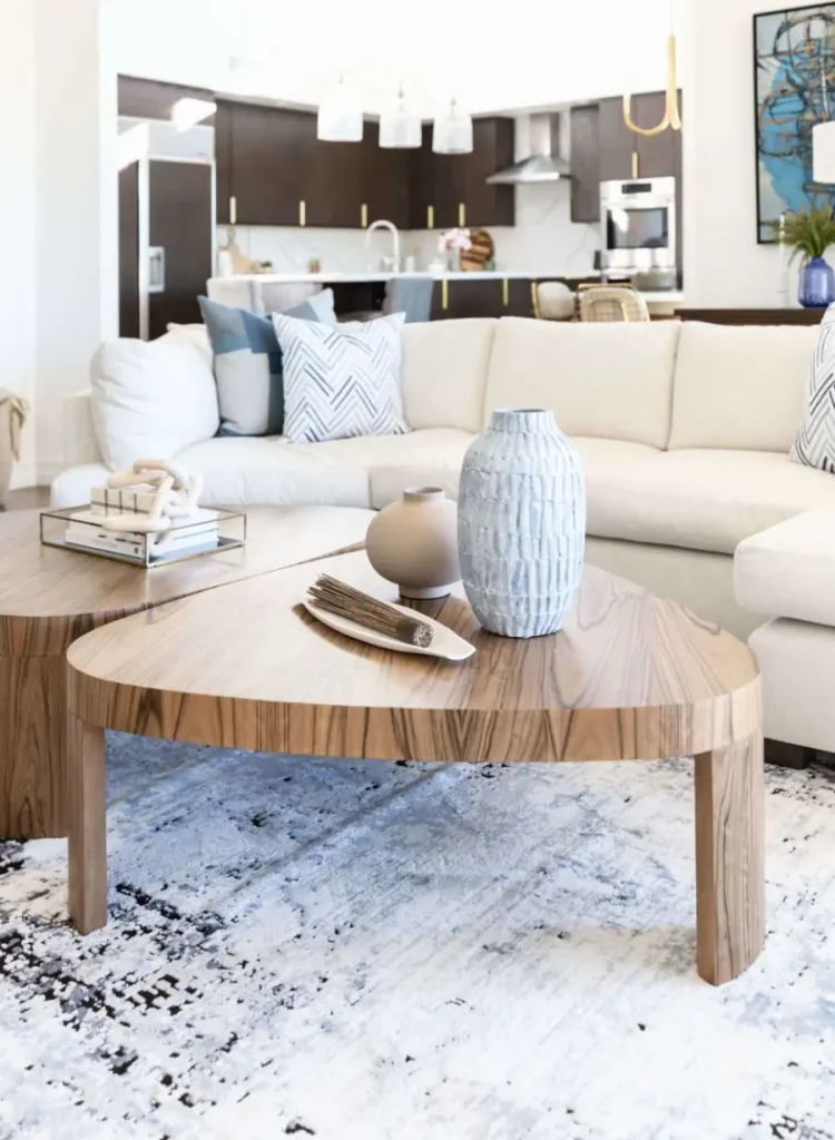 Coffee tables with vases in cozy living room