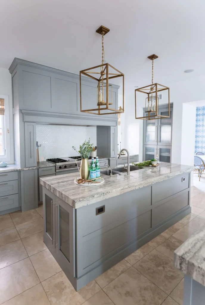 Elegant kitchen with gray cabinets and marble island