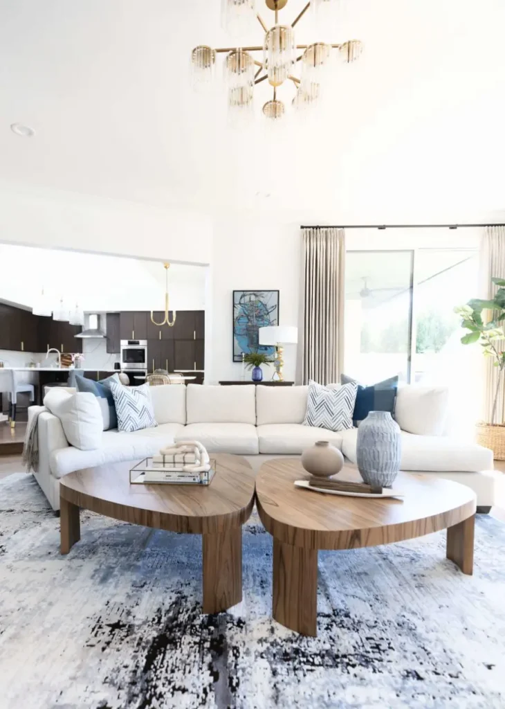 Spacious modern living room with wood tables and white sofa