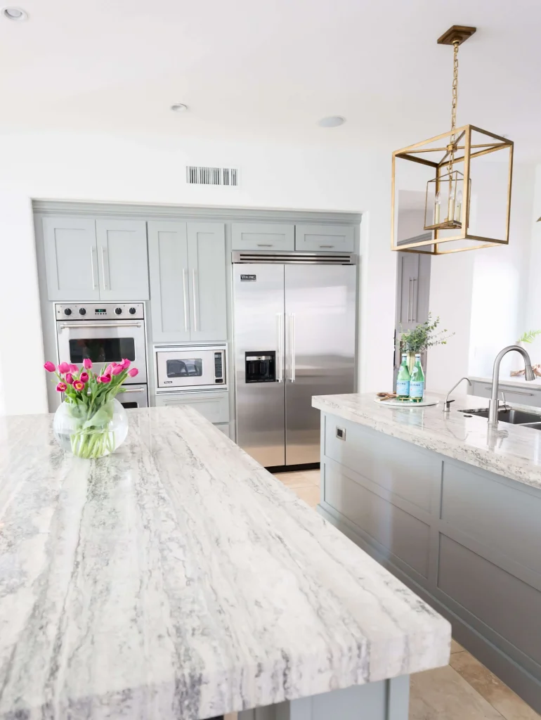 Modern kitchen with marble countertops and stainless appliances