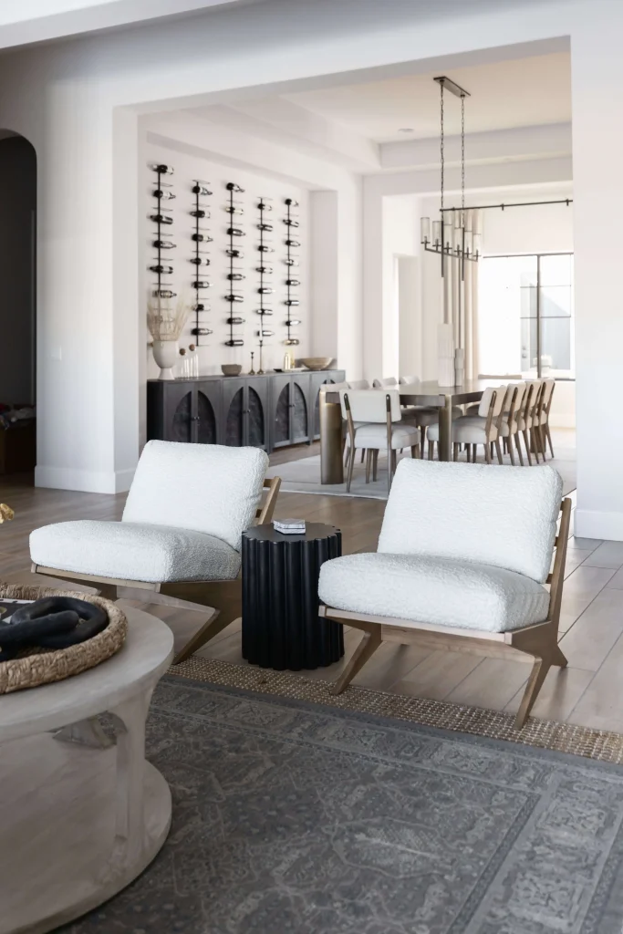 Cozy seating with white chairs and black side table