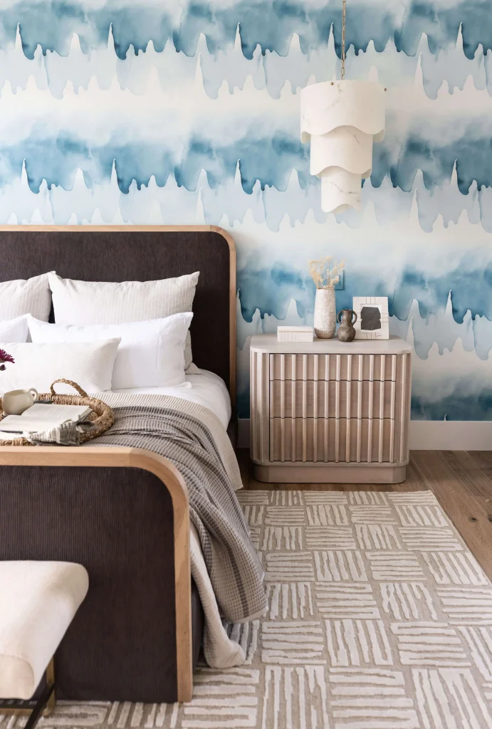 Cozy bedroom with blue watercolor wall
