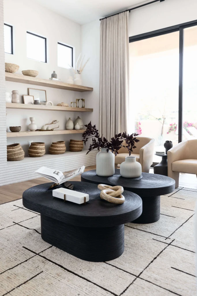Living room with black coffee tables and shelves