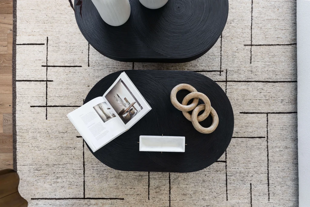 Black coffee tables with decor items