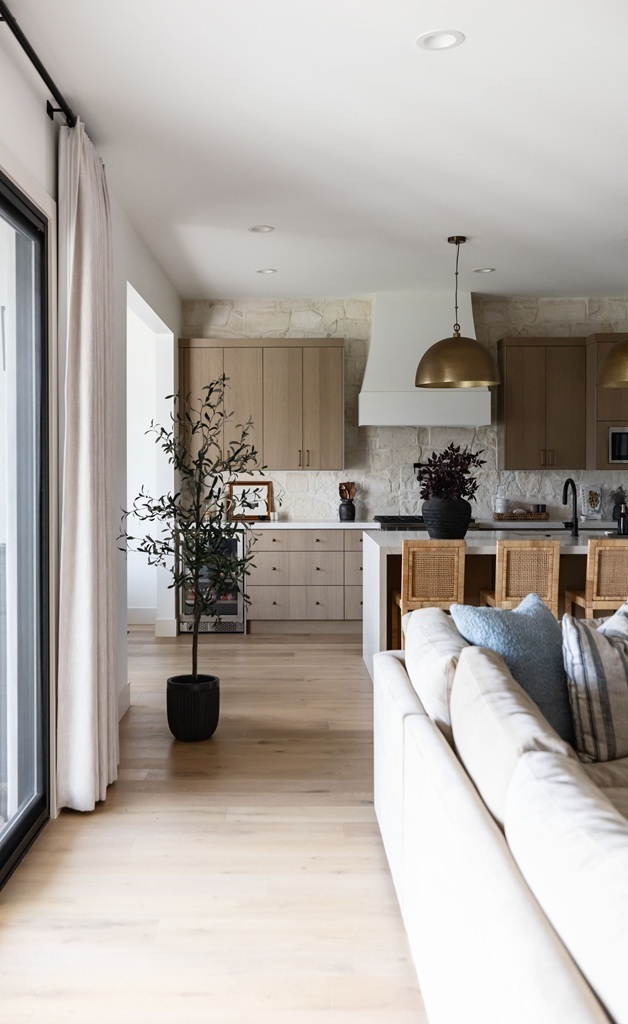 Bright kitchen with wood accents and plants