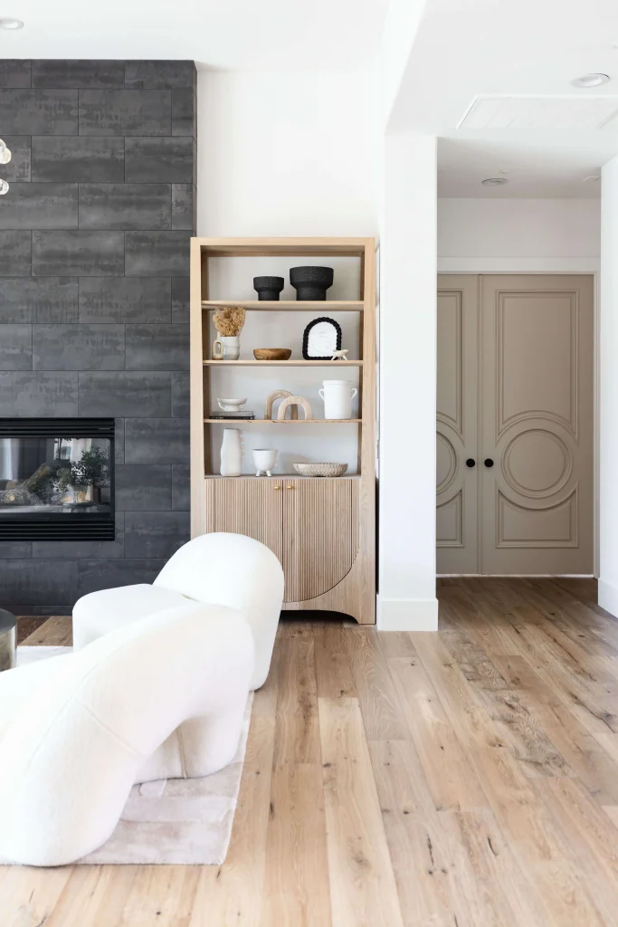 White chairs near fireplace and shelves