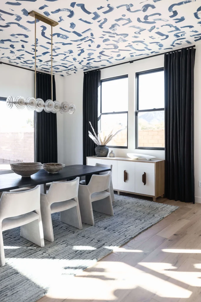 Modern dining room with patterned ceiling design