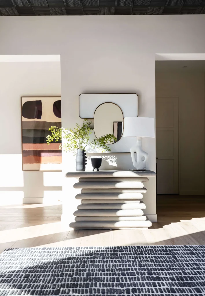 Stylish entryway with console table and wall mirror