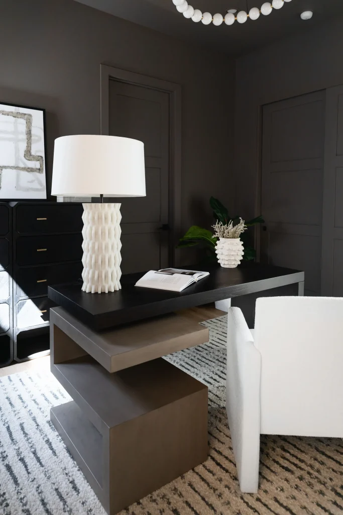 Modern desk setup with white lamp