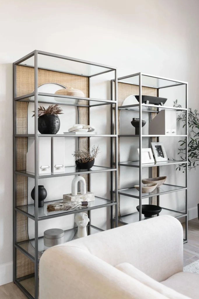 Modern glass shelving with curated decor pieces