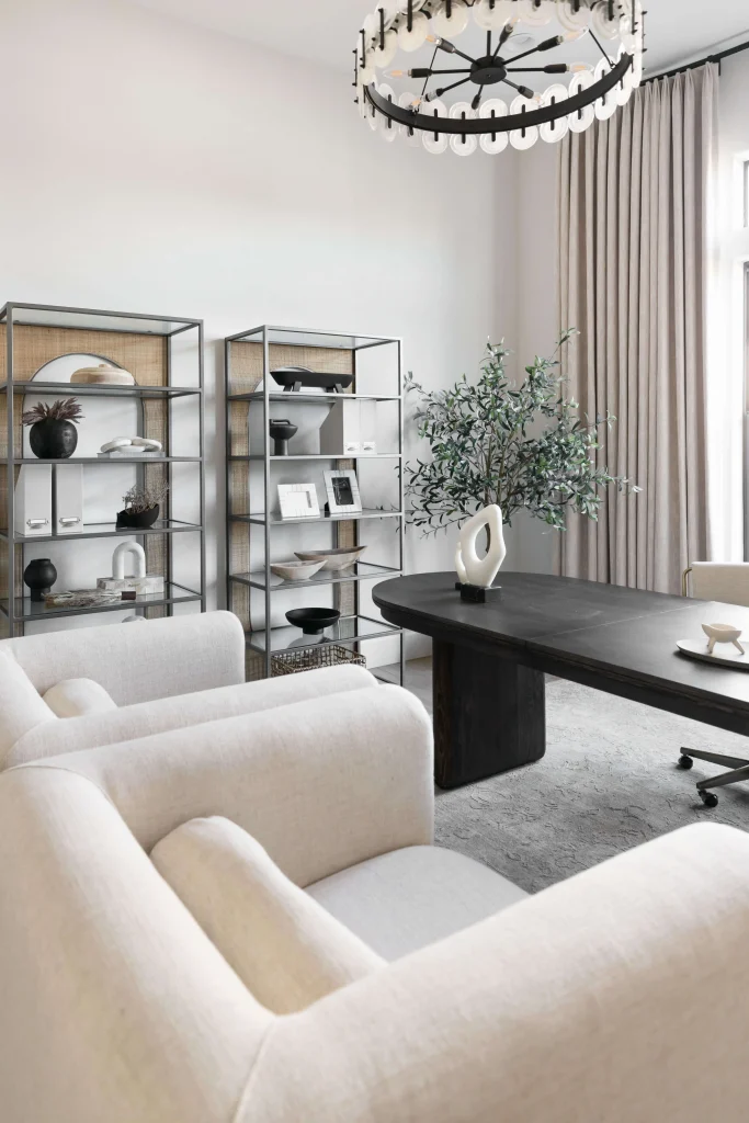 Modern office with open shelving and soft seating