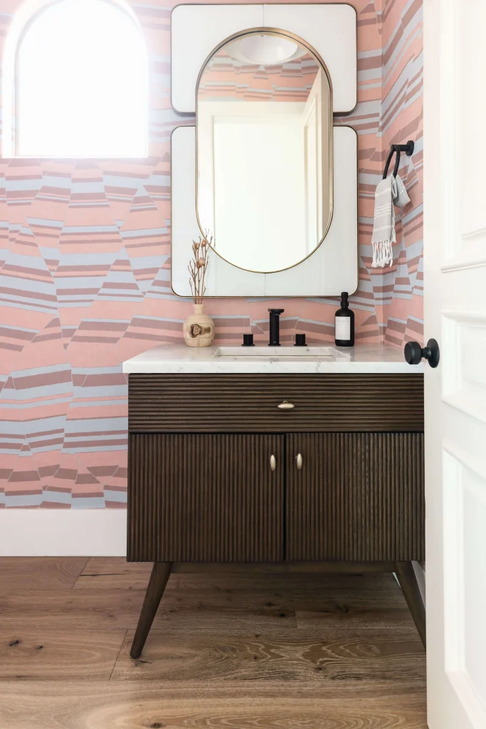 Modern bathroom with pink patterned walls