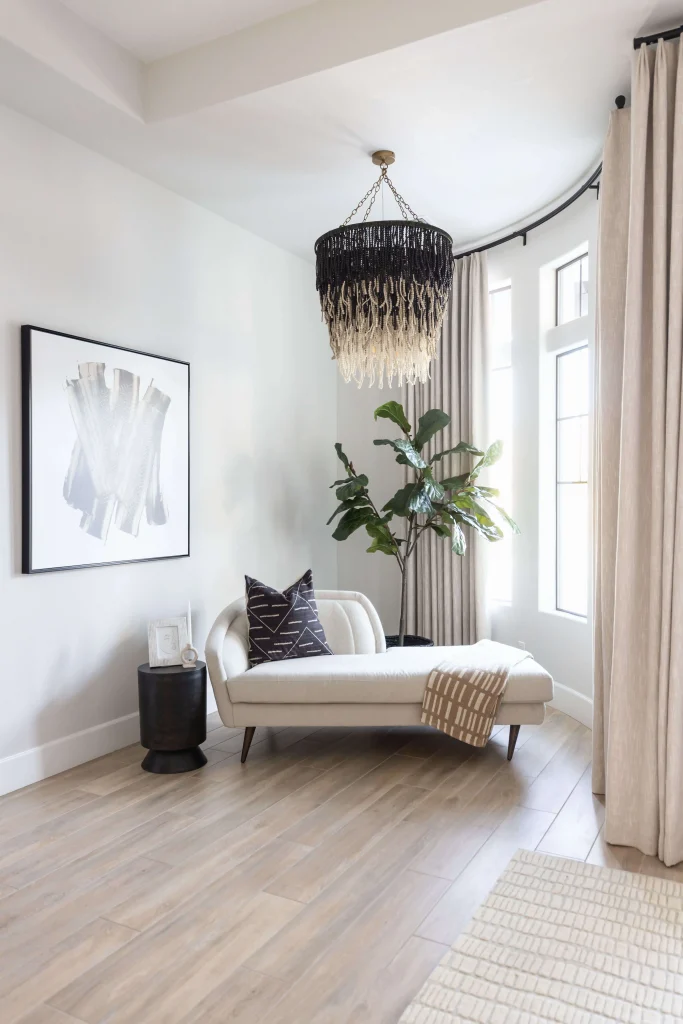 Reading nook with lounge chair and beaded chandelier