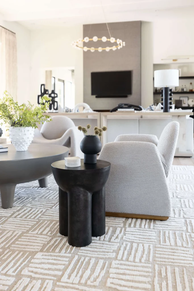 Cozy modern living room with neutral furniture and patterned rug