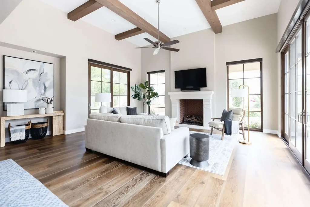 Bright living room with wood beams and neutral furniture