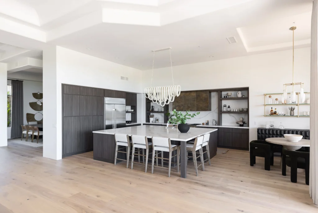 Kitchen with dark lower cabinets and white upper walls