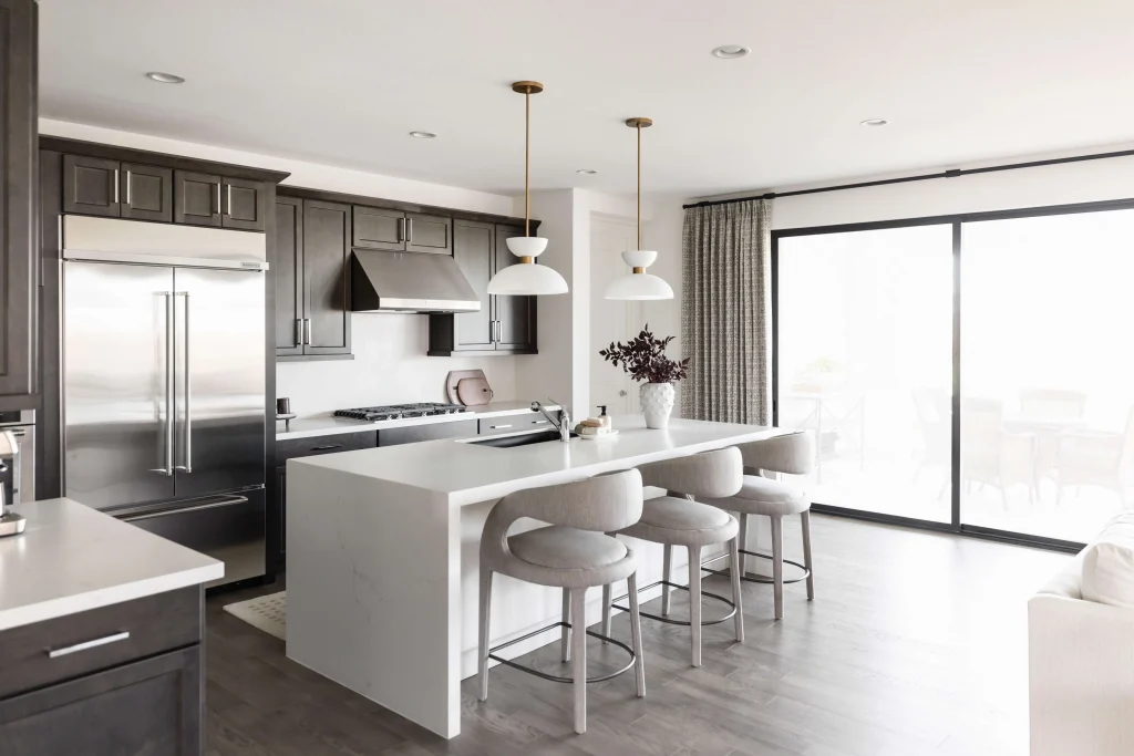 Kitchen with dark cabinets and white island