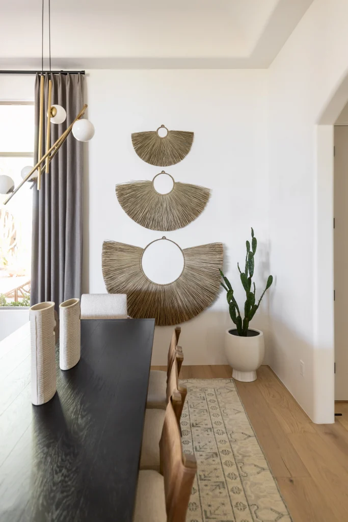 Dining space with decorative wall art and cactus plant