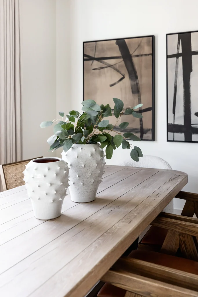 Close-up of two white textured vases