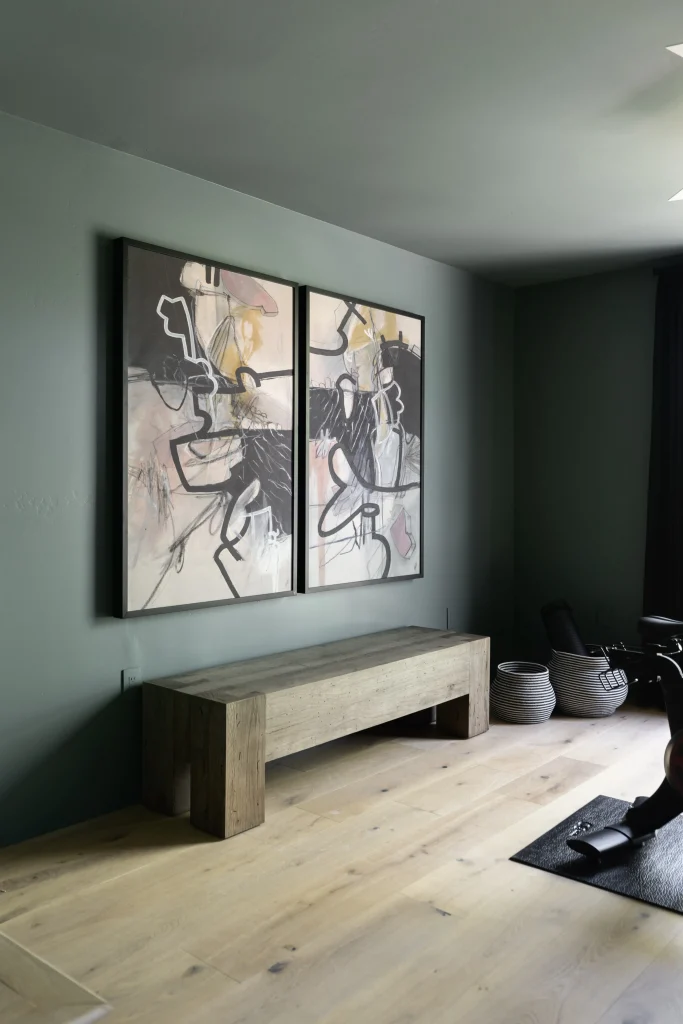 Room with green accent wall and abstract artwork and Modern Bench