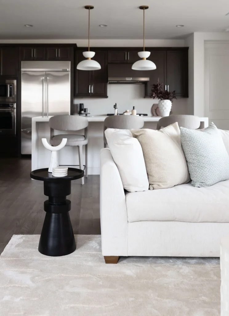 Cozy living room with beige sofa and black side table