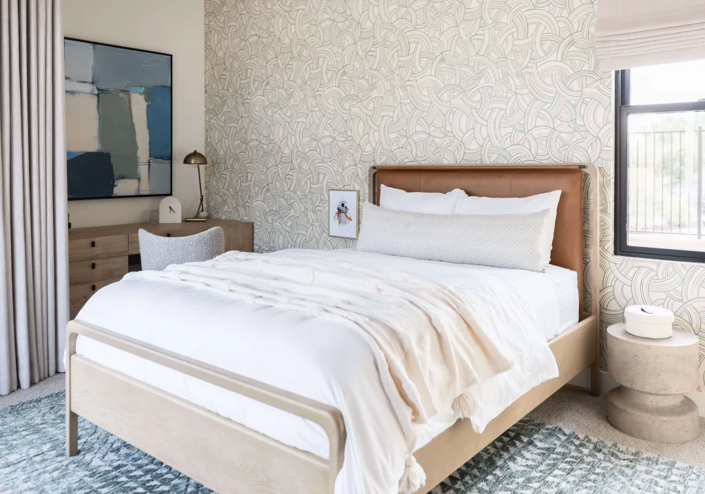 Modern bedroom with wood bed and patterned accent wall