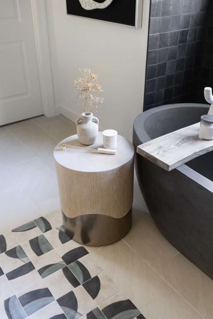Bathroom side table with vase and candle decor