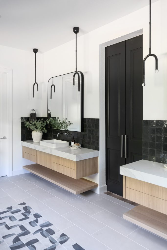 Floating vanity with modern black pendant lights