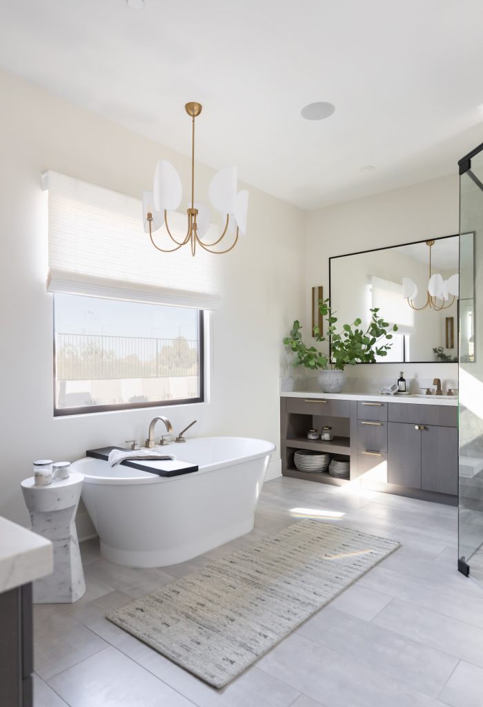 Freestanding tub with vanity and large mirror