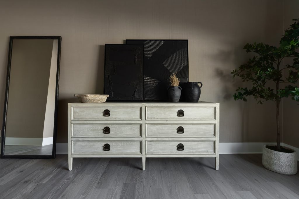 Neutral dresser with black decor and mirror