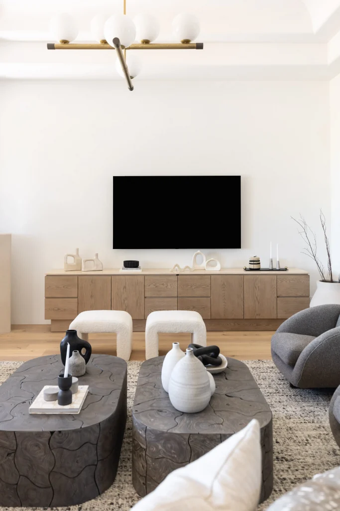 Living room with wooden console and modern chandelier