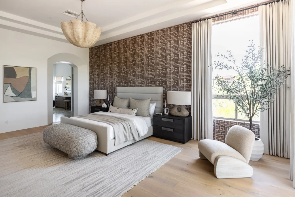 Bedroom with textured wall and neutral furnishings